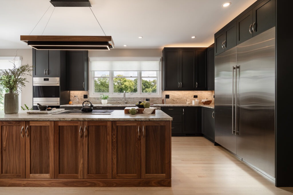 Dark kitchen cabinetry with wood-tone island, Vernon Hills kitchen remodel by Glenbrook Remodeling.